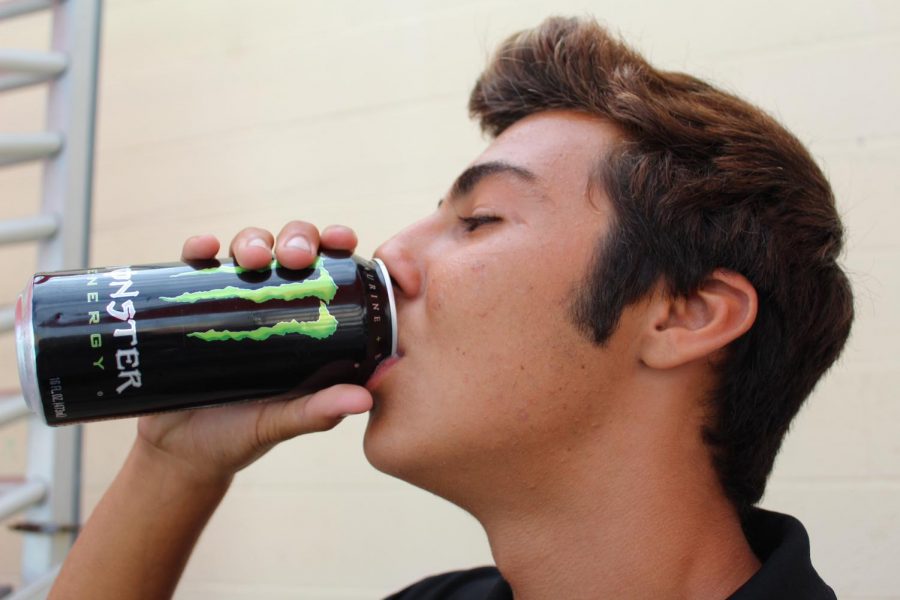 Freshman, Kirin Kunkle, drinking a Monster energy drink. Photography by: Jericho Callender