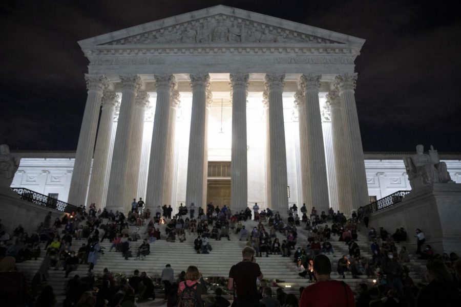 Citizens memorialize RBG on the steps of the Supreme Court. (Photography from: Tribune Content Agency LLC, Chicago, 2020. eLibrary.)