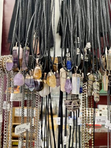 Photo of an assortment of crystal necklaces at Ipso Facto. Photography by Alexis Jacinta