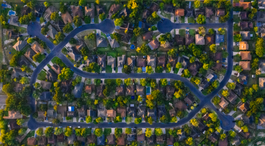 Birds Eye View of Houses.  A collection of suburban houses in a neighborhood. Fair use via Pexels. 