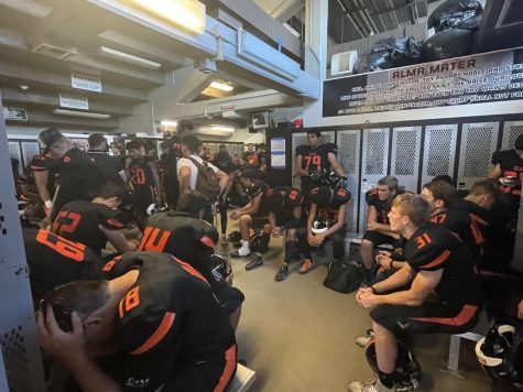 This is a picture of the Huntington Beach High School football team in the locker room. (Photography by: Jacob Totah)