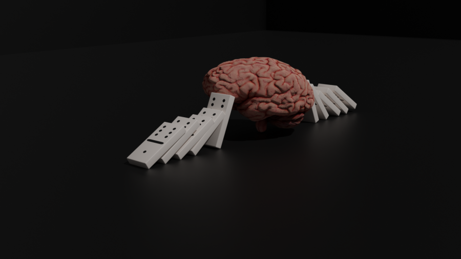 Dominos of mental health leading to the brain (Photography by: August Berrios).