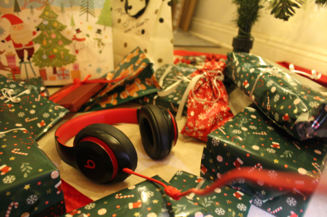Beats headphones sit in the middle of a pile of presents under a Christmas tree (Picture by: Izzy Vosper)
