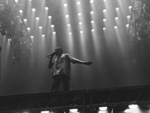 Kanye West is captured performing on stage during his, Saint Pablo Tour, on September 5, 2016.
Jamielandis101, CC BY-SA 4.0 , (Photography by: Wikimedia Commons). 