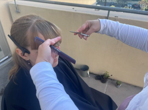 Kirstin Groat cutting Katherine Meschuks hair. (Photography by: Natalie Meschuk)