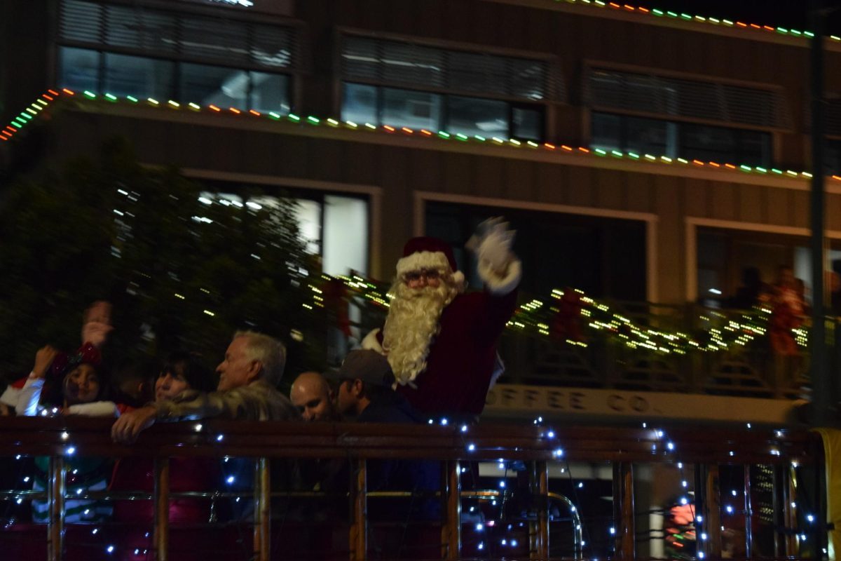 Santa Claus waving to the audience during the Seal Beach Christmas Parade. 
