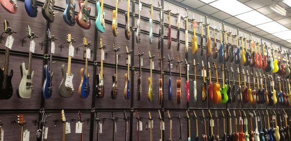 The electric guitar wall that is featured inside of Guitar Center. 
