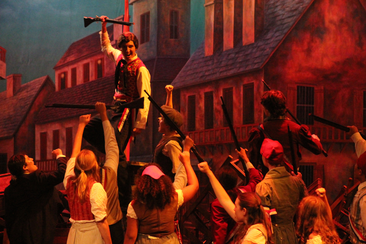 The Barricade during Les Misérables tech week, featuring Cooper Lopez as Enjorlas. (Photography by: Ariel De Lucas)