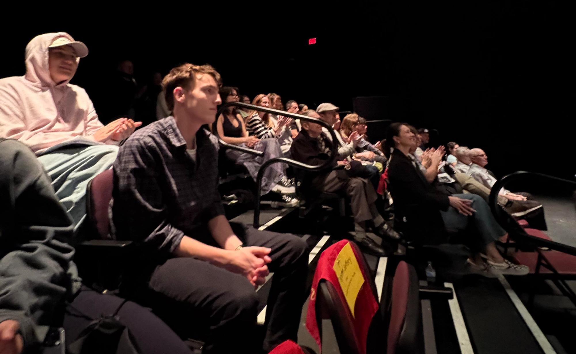 A crowd gathers to watch the opening night of "Backstage at the Harmon" (Photography by Jaden Stock)