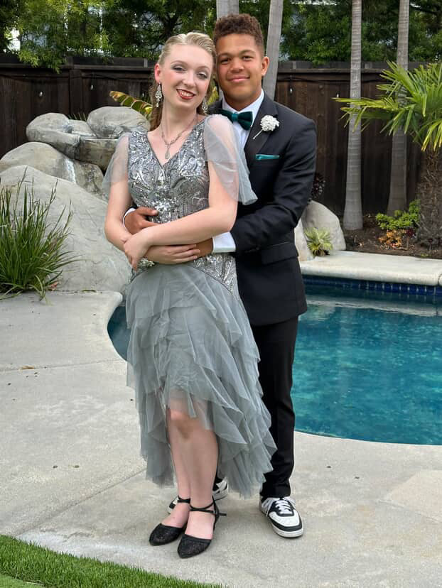 Longheyer and her boyfriend taking photos together before prom started.