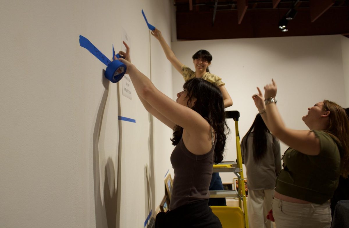 Huntington Beach High School Students deciding the layout for their art exhibit