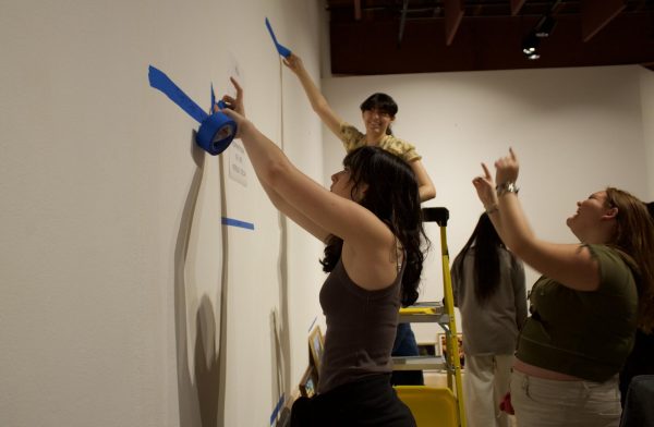 Huntington Beach High School Students deciding the layout for their art exhibit