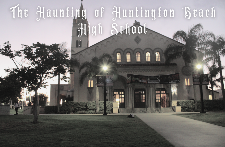 A spooky landscape of the Huntington Beach High School auditorium at night.
