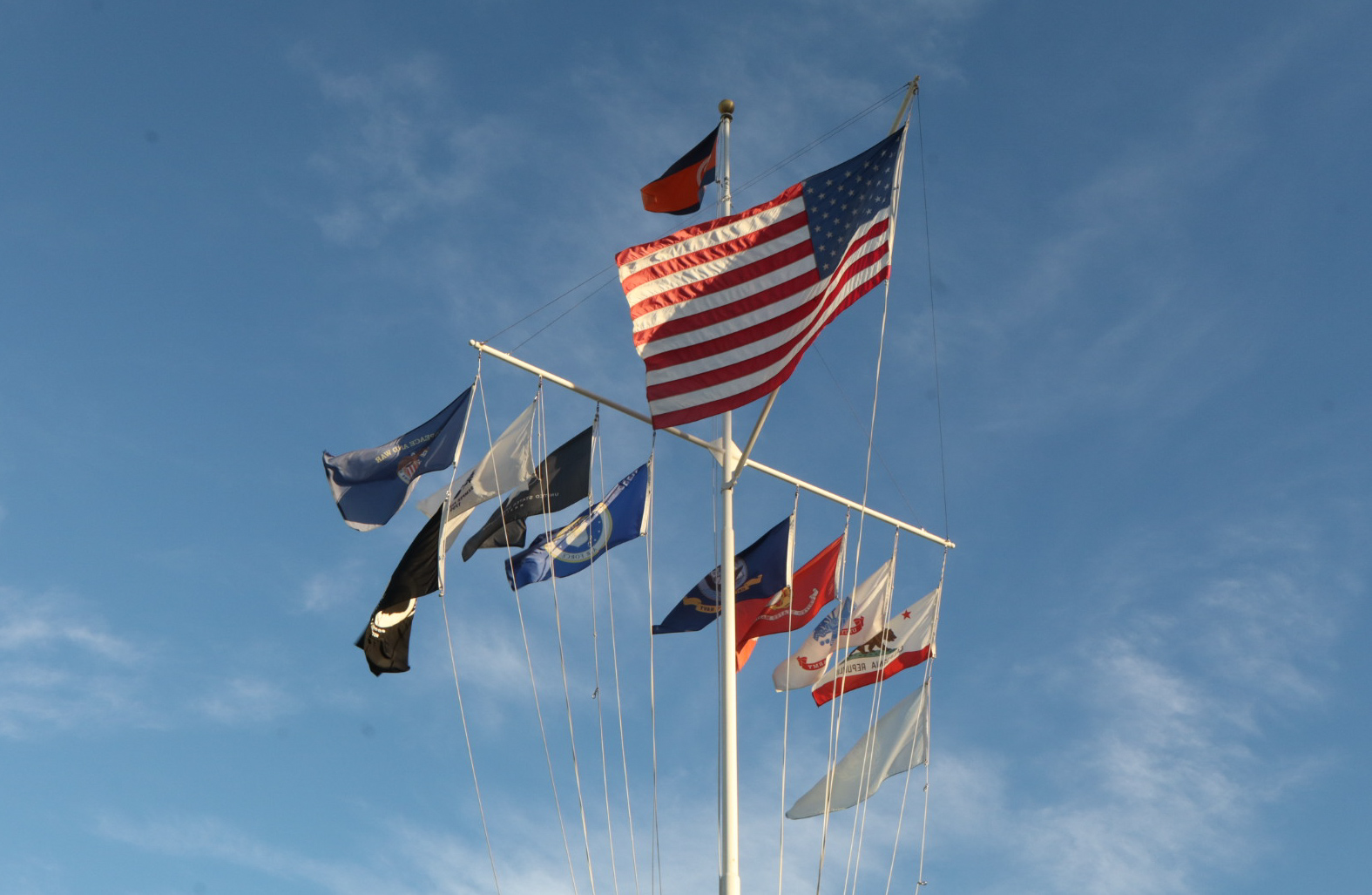 Flags in Orange Coast College's quad which resemble boat sails.