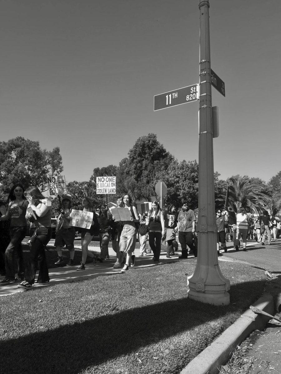 HBHS students march in unison down Main St. in protest of ICE.